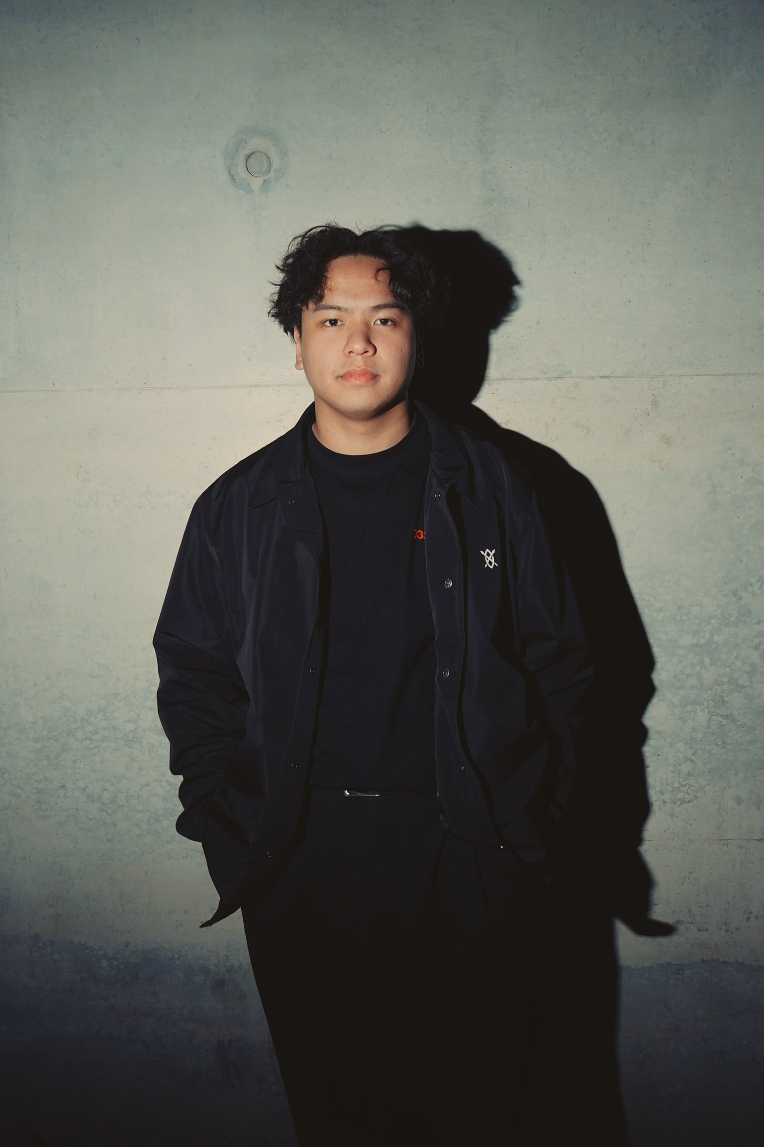 GESHA photographed against a concrete wall in Berlin